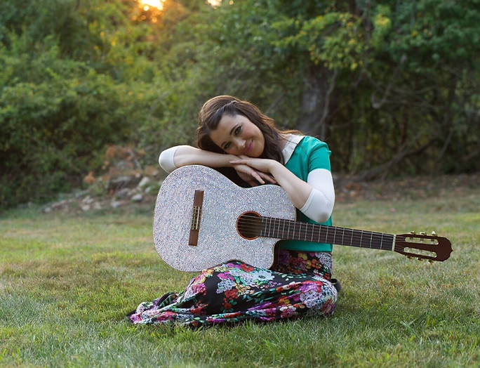 Shaindel with her guitar